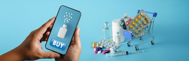 Hand holding a smartphone with a buy button next to a shopping cart filled with medical supplies representing pharmacy delivery services in Abu Dhabi.