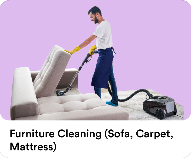 Cleaning professional vacuuming a fabric couch to showcase expert sofa cleaning, carpet shampooing, and mattress sanitization.