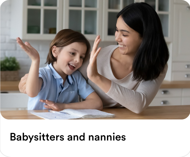 Happy nanny high-fiving a child during a homework study session to showcase professional babysitters and nannies at home services in Dubai.