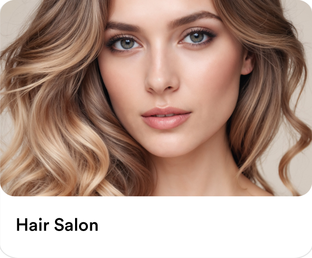 Close-up of a woman with beautiful, professionally styled wavy blonde hair showcasing expert home hair salon blow dry and coloring services.